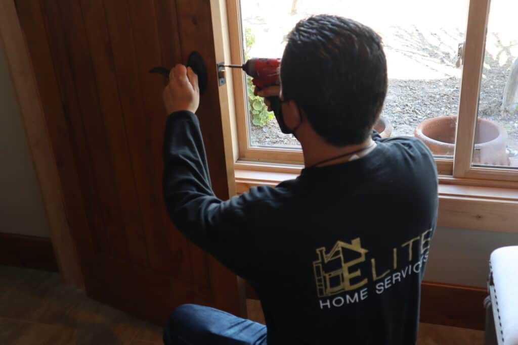 Handyman working on Door Knob Replacement