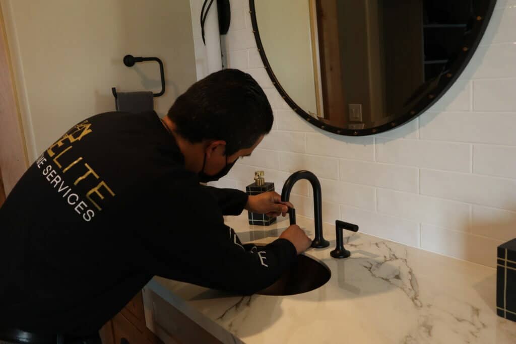 Handyman working on Bathroom Faucet Handle Repair
